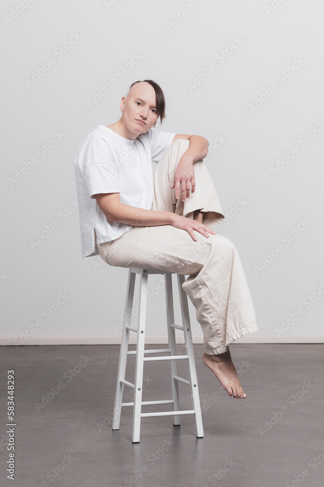 Studio Image of mid twenties girl, with half shaved head Studio Image of mid twenties girl, with half shaved head