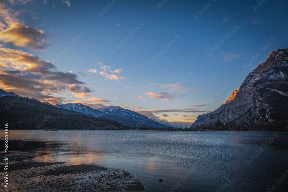 the sunrise on Lake Toblino in the province of Trento in Italy. January 2023