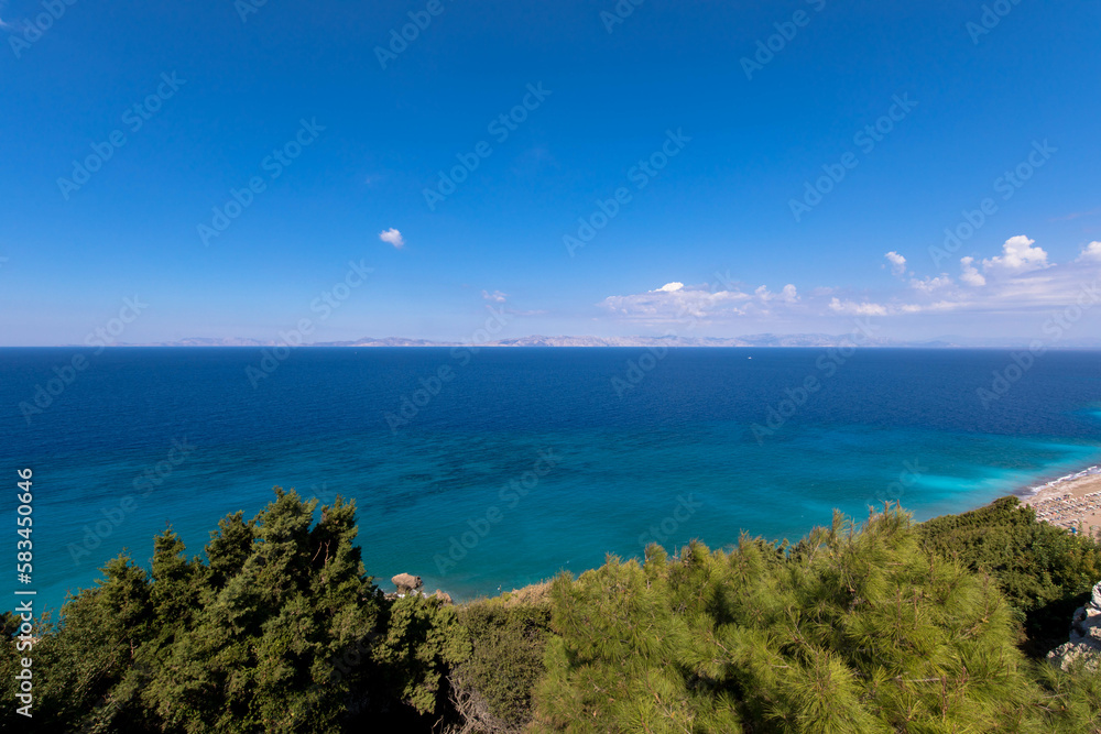 Panoramic view of the turquoise Aegean Sea with plants and hills. In the northwestern part of the Greek island of Rhodes.
Greece Europe.