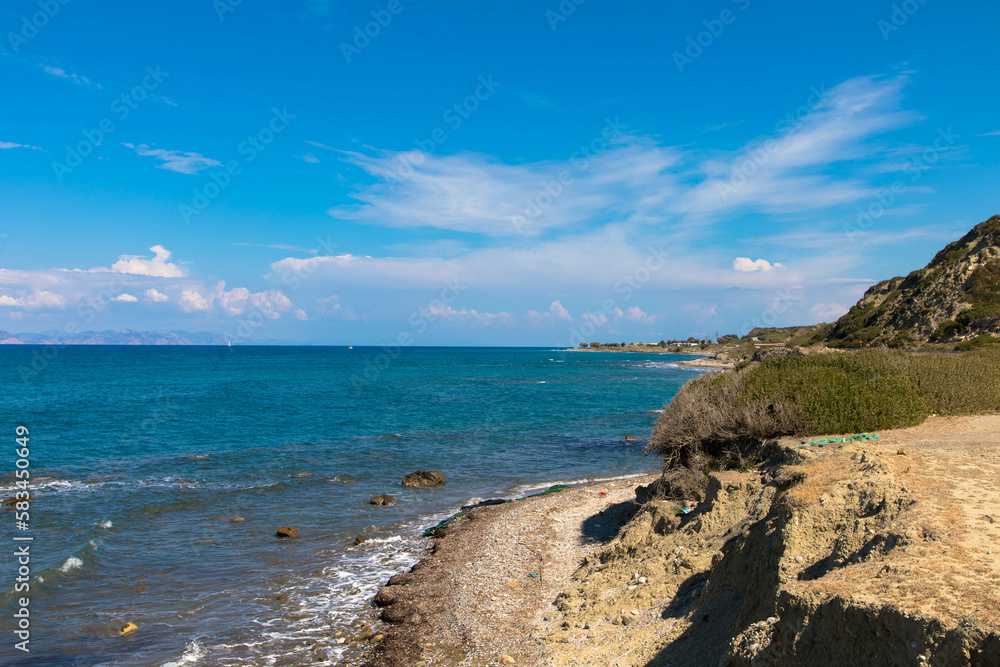 Panoramic view of the deserted Amiros beach. Located in the northwestern part of the Greek island of Rhodes. Panoramic view of the deserted Amiros beach. Located in the northwestern part of the Greek island of Rhodes.