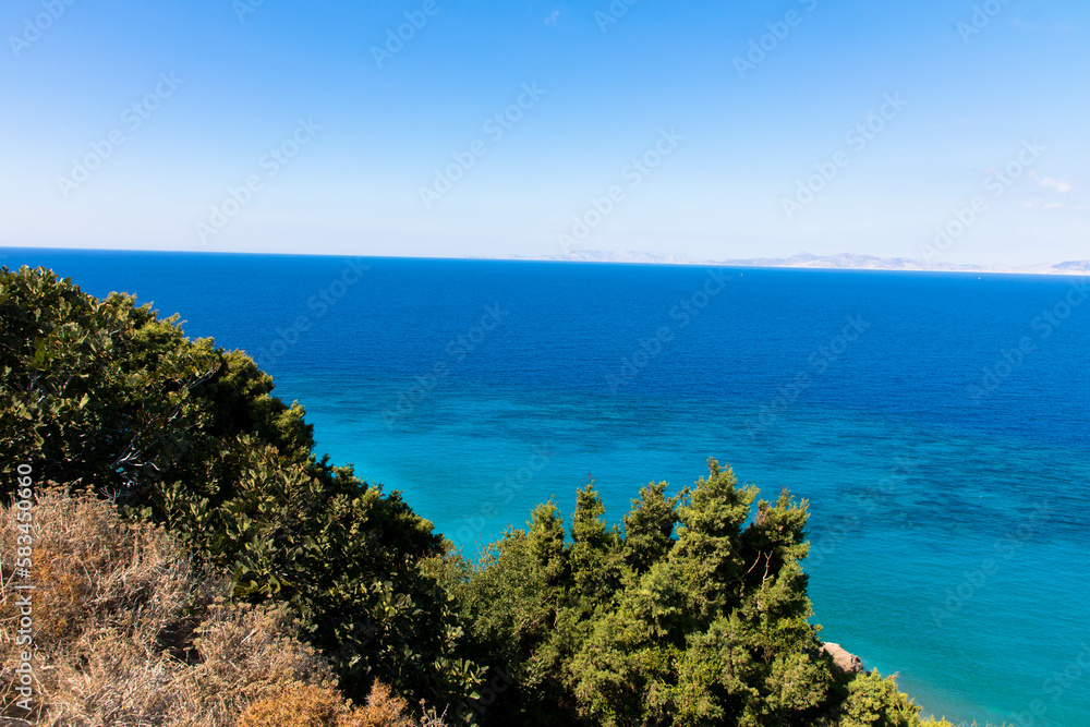 Panoramic view of the turquoise Aegean Sea with plants and hills. In the northwestern part of the Greek island of Rhodes.
Greece Europe.
