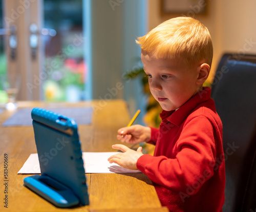 little child using laptop
