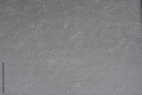 Backdrop - gray semi-smooth wall with stucco lace finish