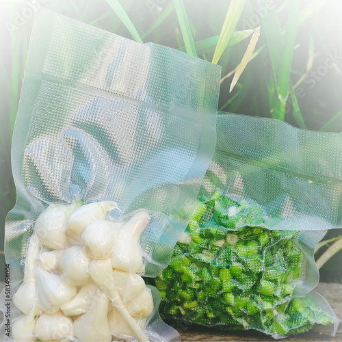 Harvest time, Vacuum Sealed Greenery. Fresh green vacuum sealed ready for sous vide cooking. White Vignette photo