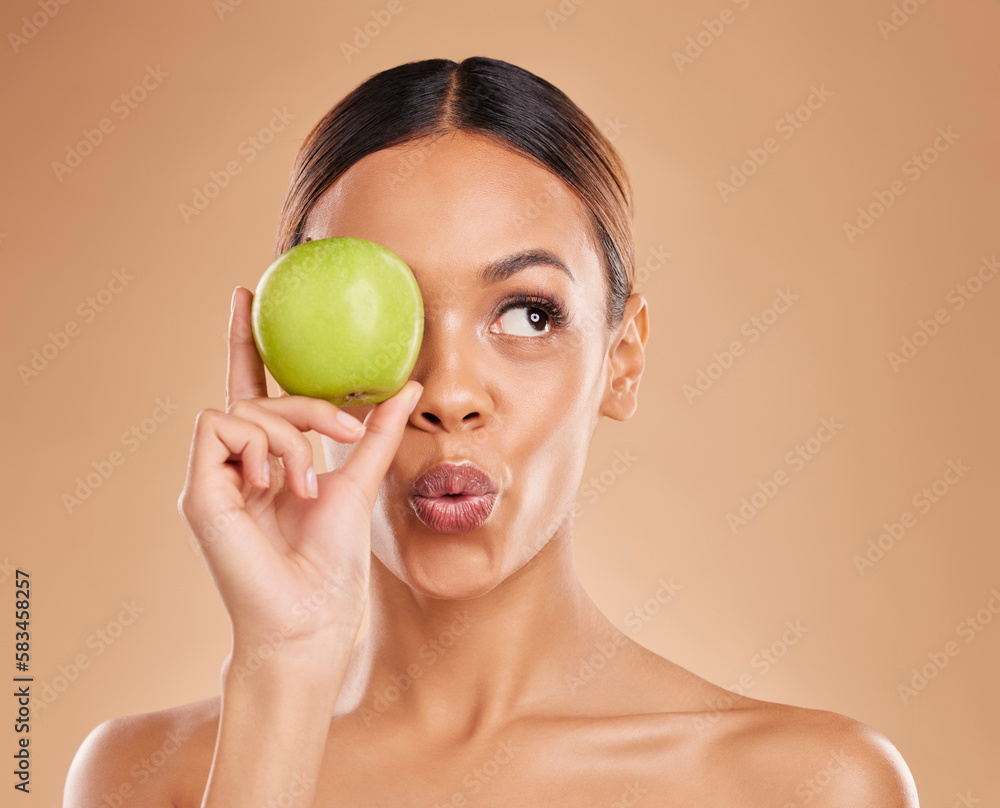 Beauty, skincare or woman with apple in studio on beige background for healthy nutrition or clean diet. Eye, hand or girl model advertising or marketing natural fruits for nutrition or wellness Beauty, skincare or woman with apple in studio on beige background for healthy nutrition or clean diet. Eye, hand or girl model advertising or marketing natural fruits for nutrition or wellness