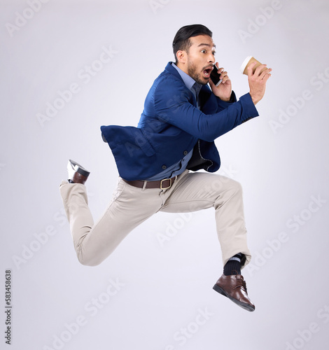 Phone call, rush and late with a business man on white background in studio running to an appointment. Conversation, coffee and hurry with a male employee sprinting fast to keep a schedule