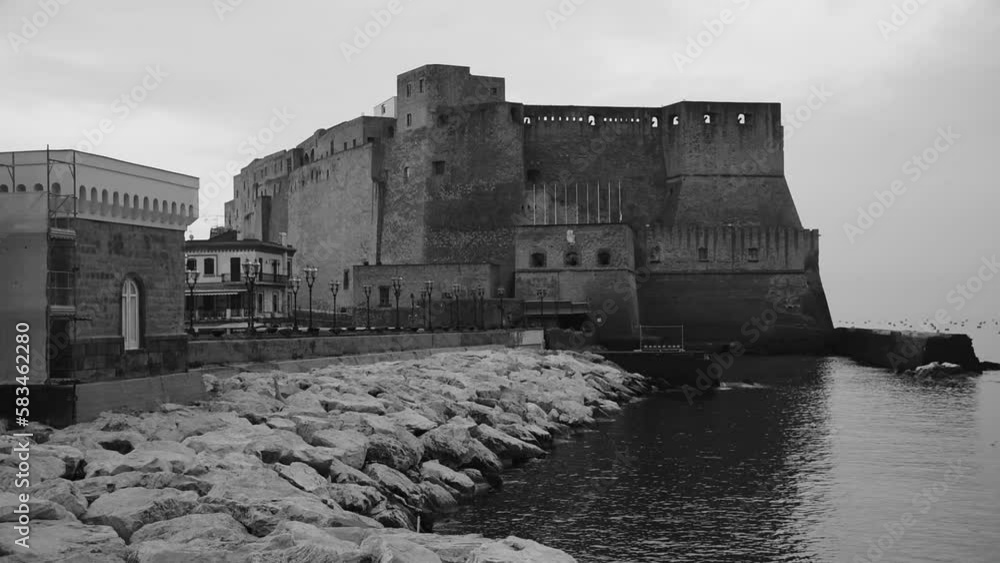 View of Castel dell' Ovo at dawn on a spring morning in Naples View of Castel dell' Ovo at dawn on a spring morning in Naples