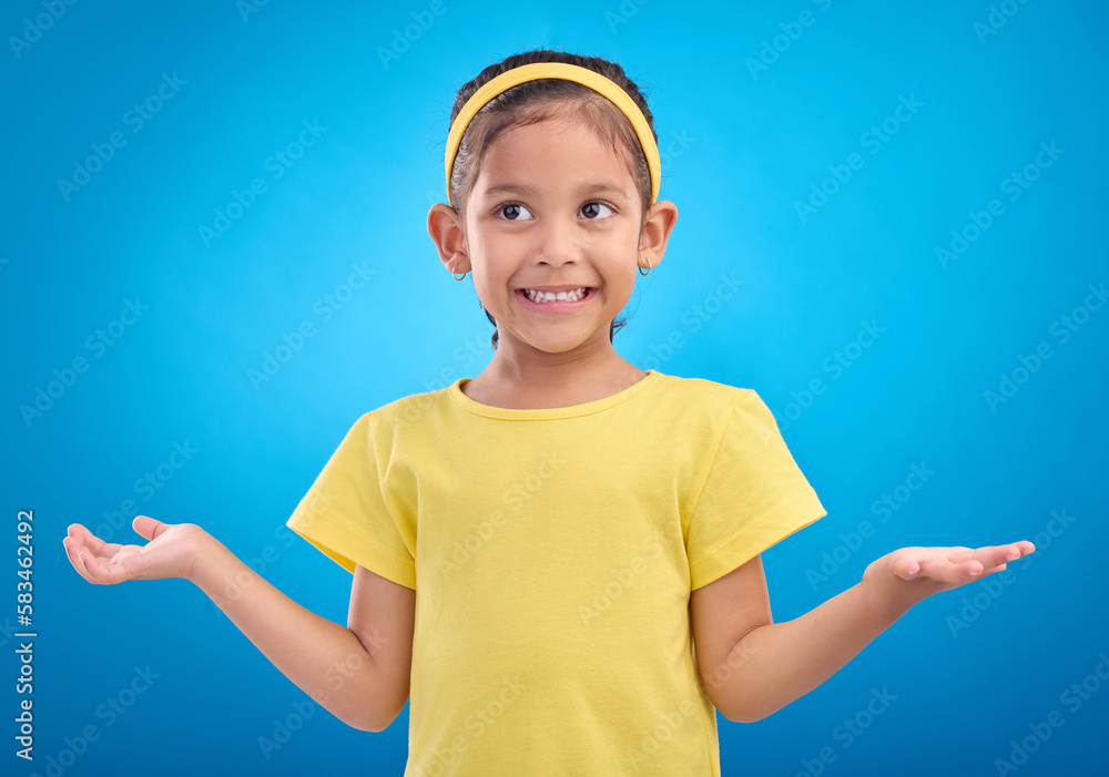 Girl, child and shrug with happy or unsure face in studio with arms and hands stretched with a smile. Kid on blue background clueless, doubt and confused about question or reaction with hand gesture Girl, child and shrug with happy or unsure face in studio with arms and hands stretched with a smile. Kid on blue background clueless, doubt and confused about question or reaction with hand gesture