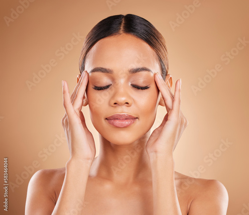 Beauty, calm and a woman with hands on face for skin care glow and natural shine in studio on brown background. Aesthetic model happy and satisfied with spa facial, dermatology cosmetic and wellness