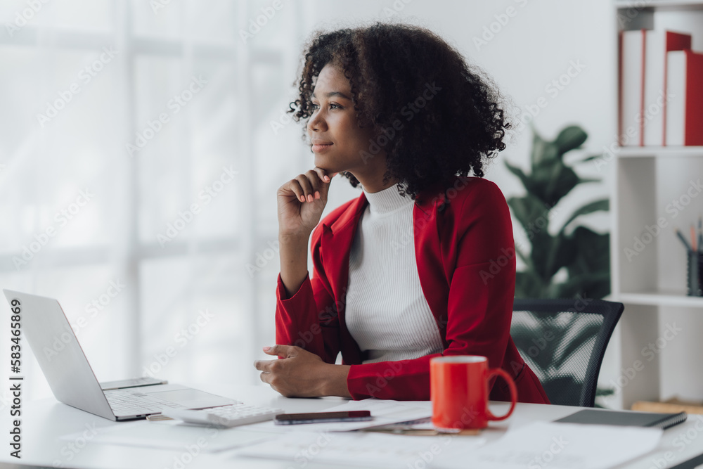Young business woman worried about problem at work and stressed about problem with laptop computer.