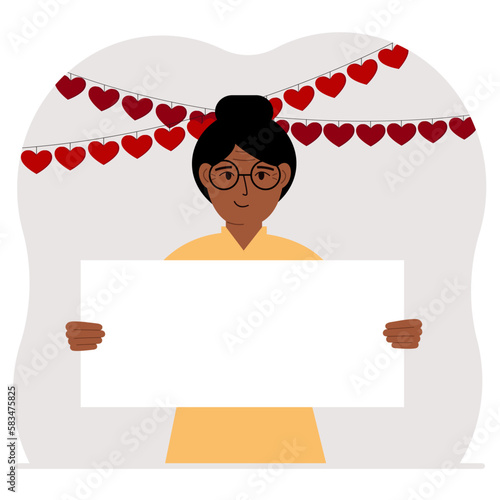 A woman is holding a large blank sheet for text. There are many red hearts nearby. The concept of Happy Women, Valentine's Day, father's day, declaration of love or holiday.