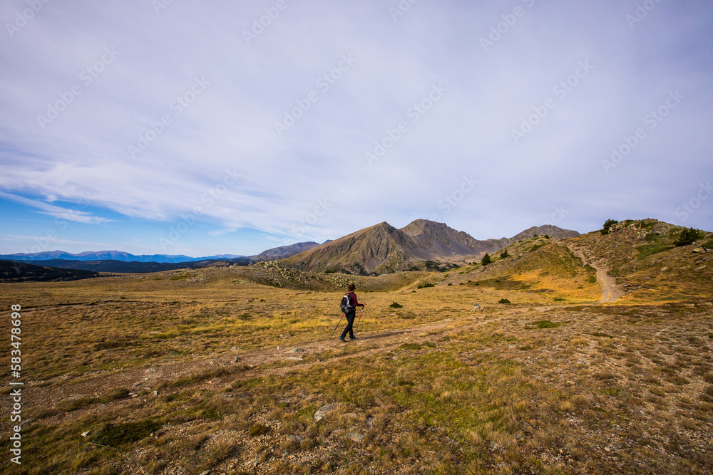 Young hiker girl enjoying in Camporrells, Pyrenees, France