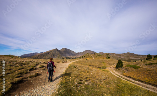 Young hiker girl enjoying in Camporrells, Pyrenees, France