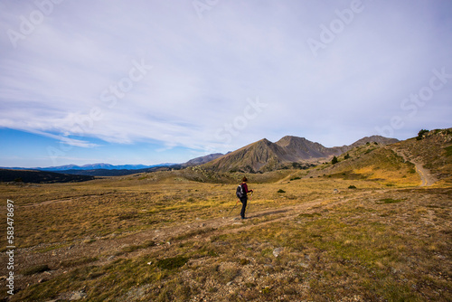 Young hiker girl enjoying in Camporrells, Pyrenees, France