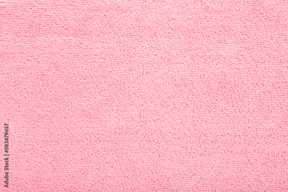 Fototapeta premium Light pink dry soft microfiber rag background. Closeup. Pastel color. Empty place for text. Top down view.