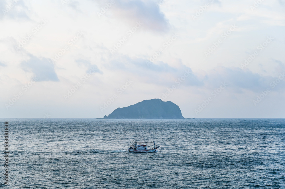 Keelung City, Taiwan - SEP 14, 2019: Ship at sea background is keelung islet.