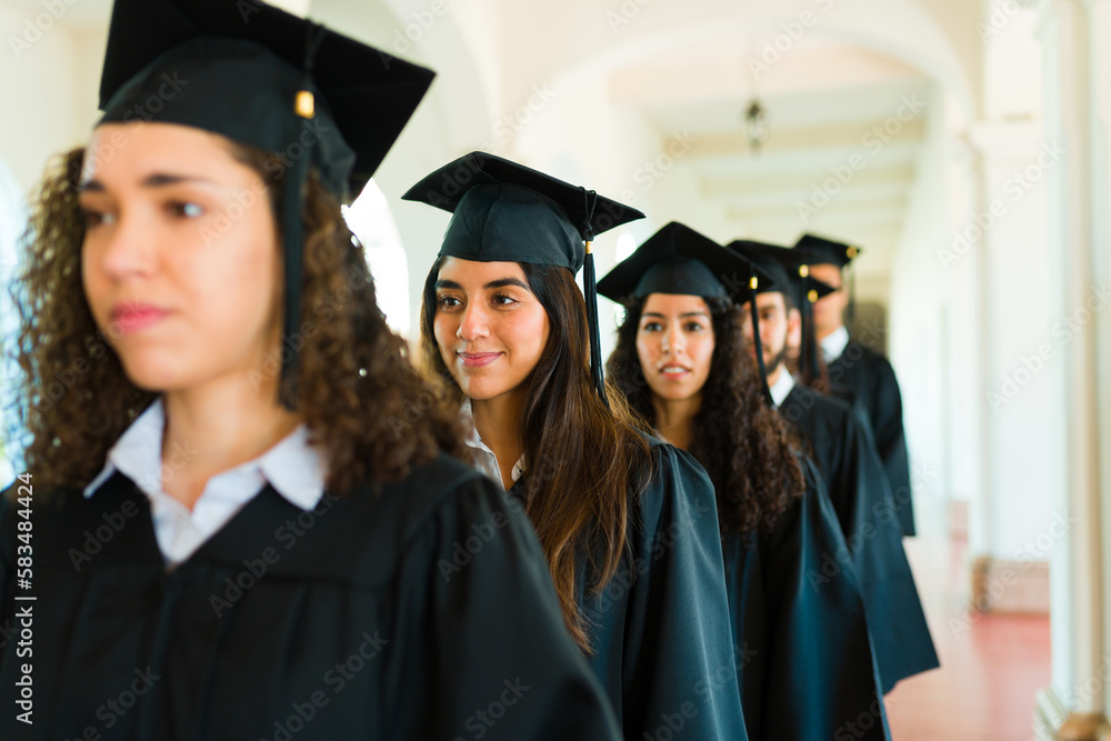 Line of young women graduating university