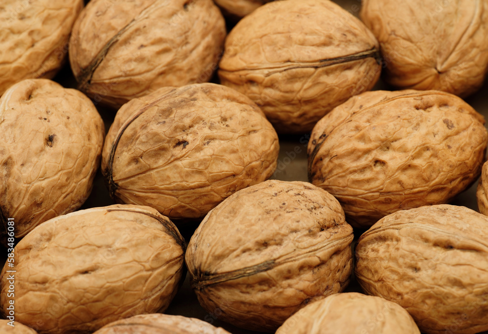 Walnut close up on a wooden table. Walnut close up. product rich in minerals and vitamins. Walnut close up on a wooden table. Walnut close up. product rich in minerals and vitamins.