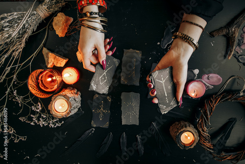 The woman's hands are holding a magic card. Halloween