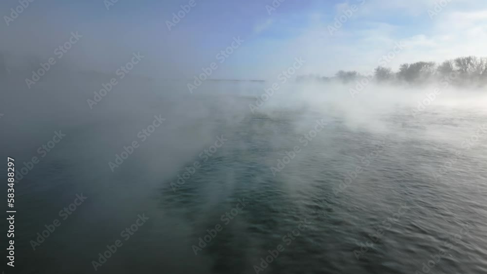 Flying Over Fog Covered Missouri River On Sunny Winter Day In Bismarck, North Dakota Flying Over Fog Covered Missouri River On Sunny Winter Day In Bismarck, North Dakota