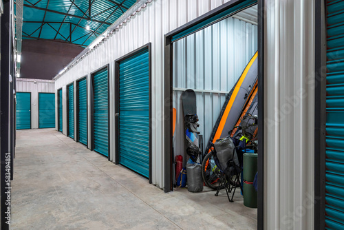 Outdoors activity items seen through the open door of the self storage unit. Rental Storage Units