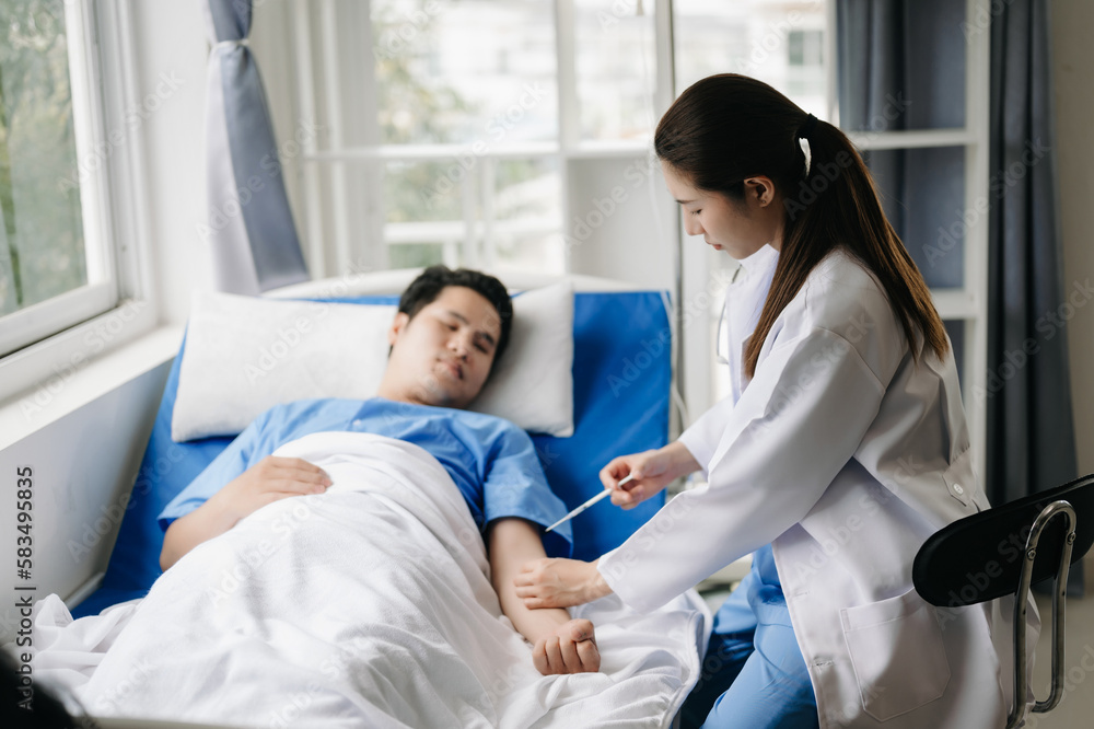 Fototapeta premium Doctor discussing treatment with male patient talking and laughing sitting on examination bed in clinic or hospital.