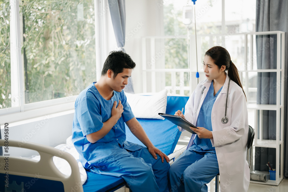 Asian male patient on bed while doctor hands of checking examining his pulse for record the treatment results in hospital. Asian male patient on bed while doctor hands of checking examining his pulse for record the treatment results in hospital.