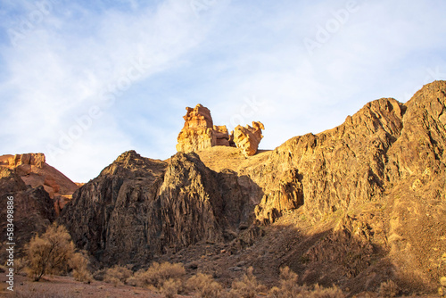 Charyn Canyon is a canyon on the Sharyn River in Kazakhstan, east of Almaty. Landscape on a clear sunny day in summer, there are many clouds in the sky. © Andrei
