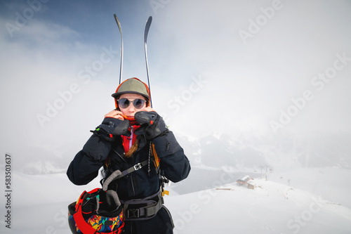 фотографія Mountaineer backcountry skiing skiing woman climber in the mountains