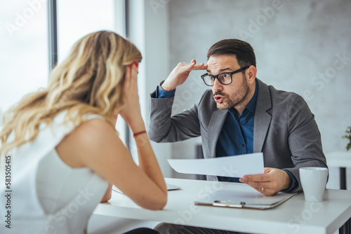 Photography Irritated businessman holding paper, disagrees with bad contract terms, refuses