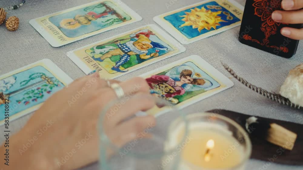 Fortune teller reading tarot cards, doing a reading for a client. Fortune teller reading tarot cards, doing a reading for a client.