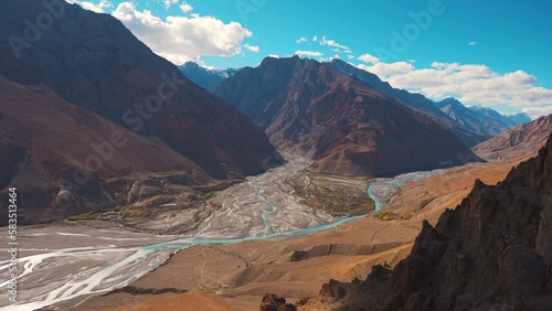 4K shot of the confluence of the River Pin and River Spiti as seen from the top of the Dhankar Monastery in Spiti Valley, Himachal Pradesh, India. Confluence of the two main important rivers in Spiti. photo