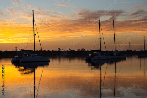 Silhouette of sailboats anchored in marina during a beautiful sunrise, St. Augustine, Florida