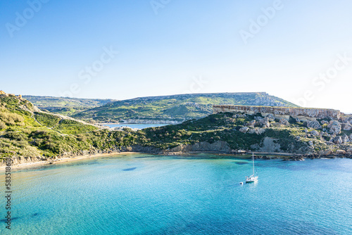 The small boat on Mediterranean sea, Qarraba Bay, Riviera Beach, Malta, Europe