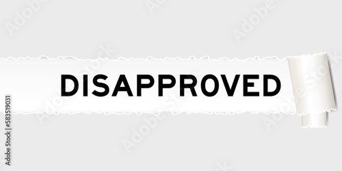 Ripped gray paper background that have word disapproved under torn part