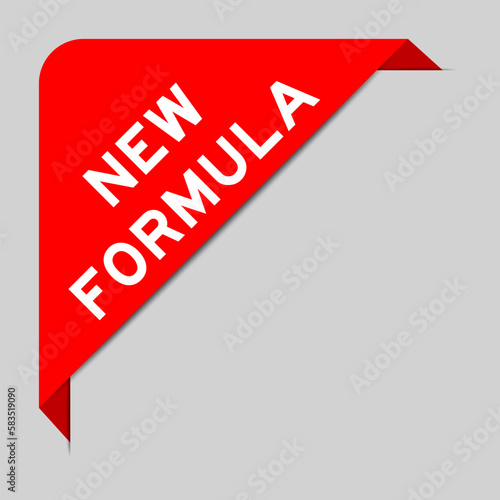 Red color of corner label banner with word new formula on gray background