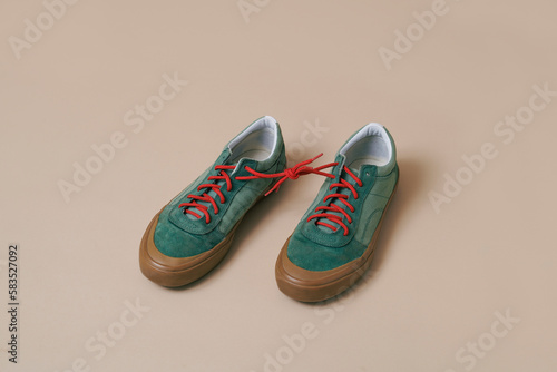 Photography sneakers with its shoelaces tied together