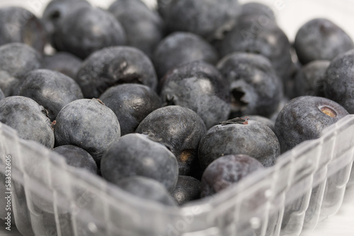Large blueberries in a decorative container. International day without diets. Close-up.