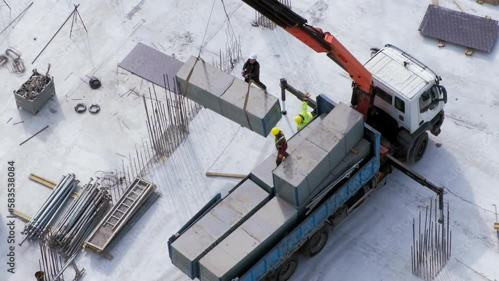 Worker was injured after falling from small truck crane at the construction site Worker was injured after falling from small truck crane at the construction site