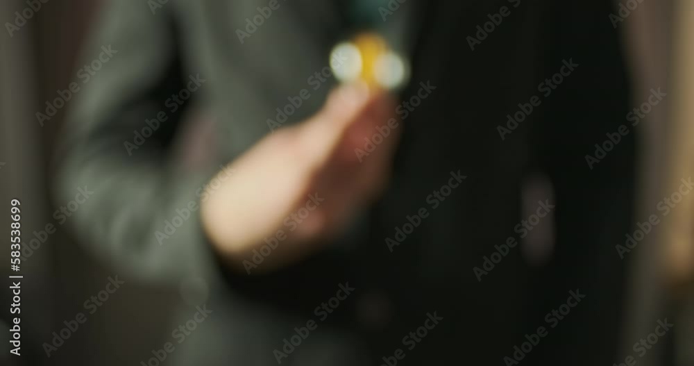 Man's hand takes out an LED light bulb made to look like an incandescent lamp from the inside pocket of his jacket. Demonstration of new technologies. Man's hand takes out an LED light bulb made to look like an incandescent lamp from the inside pocket of his jacket. Demonstration of new technologies.