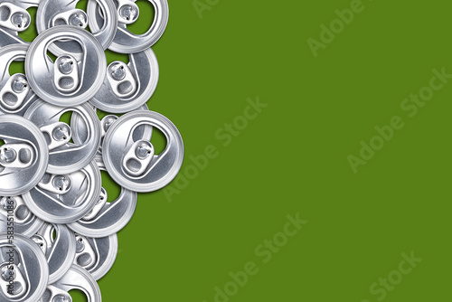 Aluminum cans. Top view. Green background. Copy space. Recycling. Reuse.