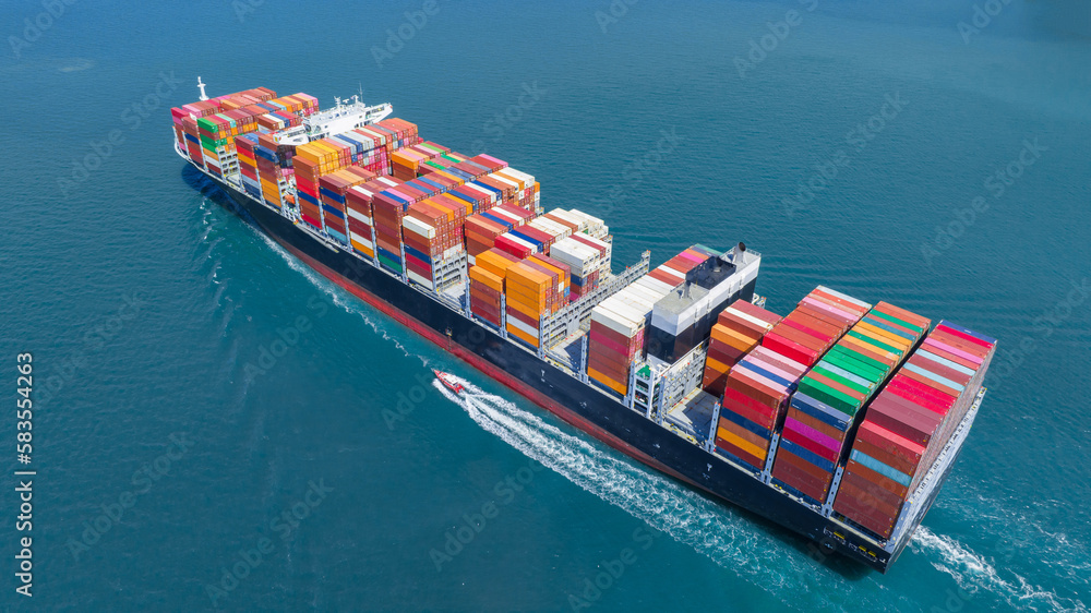 Stern of cargo ship carrying container and running for import goods from cargo yard port to custom ocean concept technology transportation , customs clearance. Freight Forwarding Service