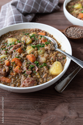 Stew with lentils, pork meat, potatoes and vegetables. Traditional german lentil soup
