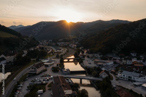 Aerial drone view of the townscape of Lilienfeld and the Traisen River during the sunset photo