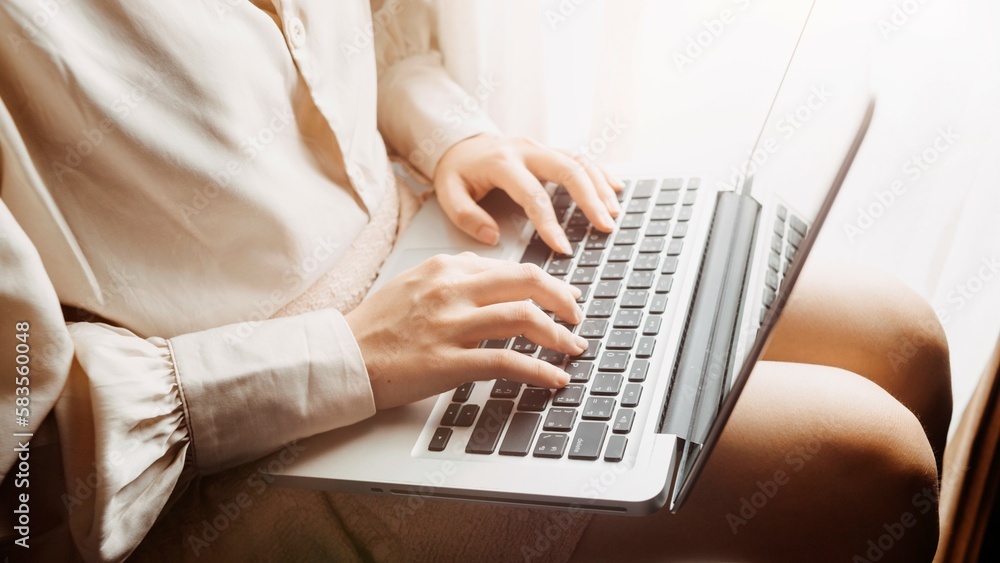 in the office, a man is typing on a laptop in the office, a man is typing on a laptop