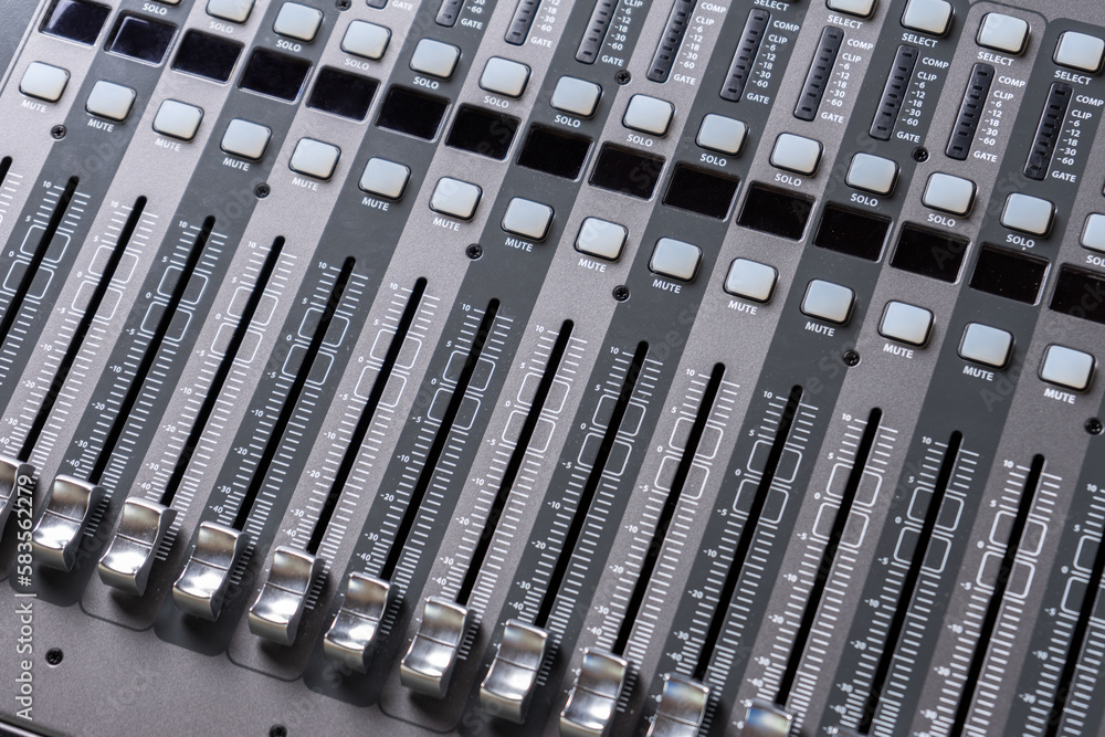 closeup view of professional audio digital mixing sound console