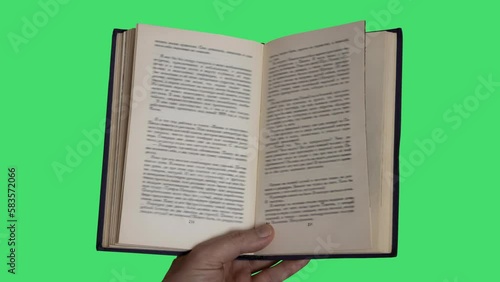Animation of books in a hand on green background
