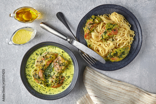 Chkemeruli, noodles with fried chicken, on a dark plate with cut photo