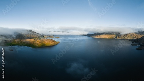 Aerial shot of an ocean with mountains in Nothern Norway
