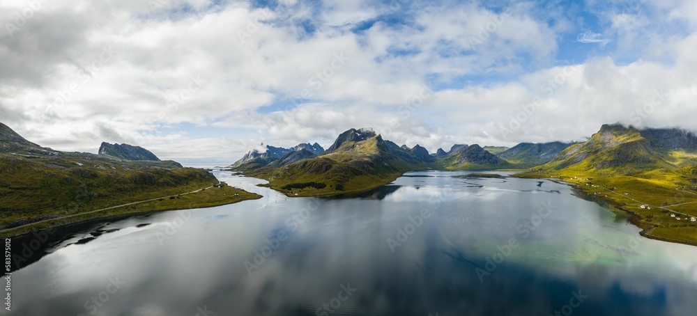 Aerial panoramic landscape of the rocky hills at the shore at Lofoten